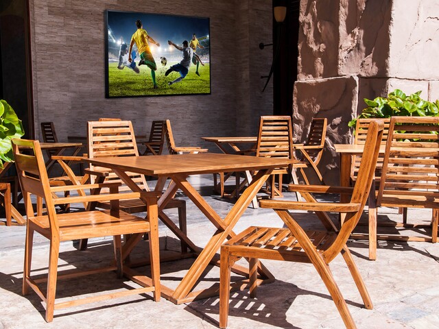 Outdoor patio with wall mounted display