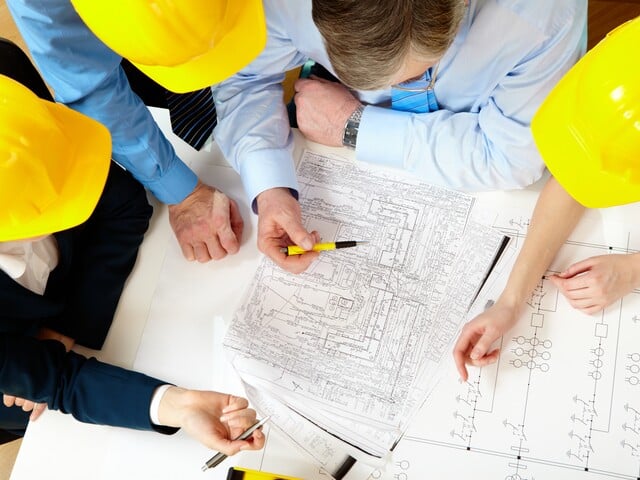 Architects with Construction Plans